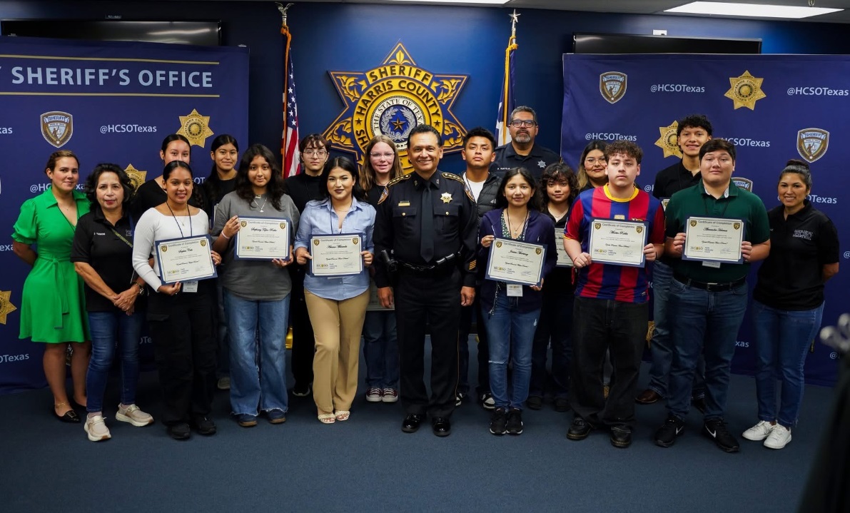 Young people and HCSO staff celebrating a youth leadership milestone